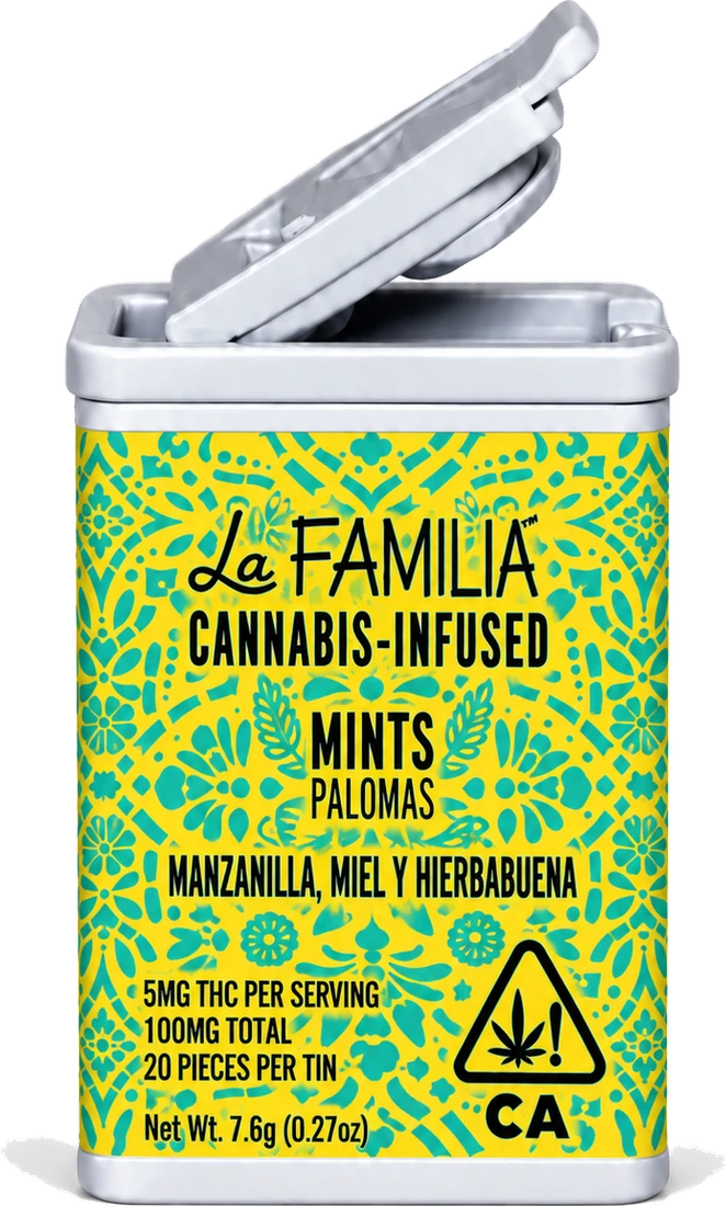 La Familia Chamomile, Honey & Spearmint Paloma Mints tin, yellow with teal pattern, lid open.